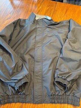 Men's Black Waterproof Rain Jacket with Elastic Hem and Stand Collar